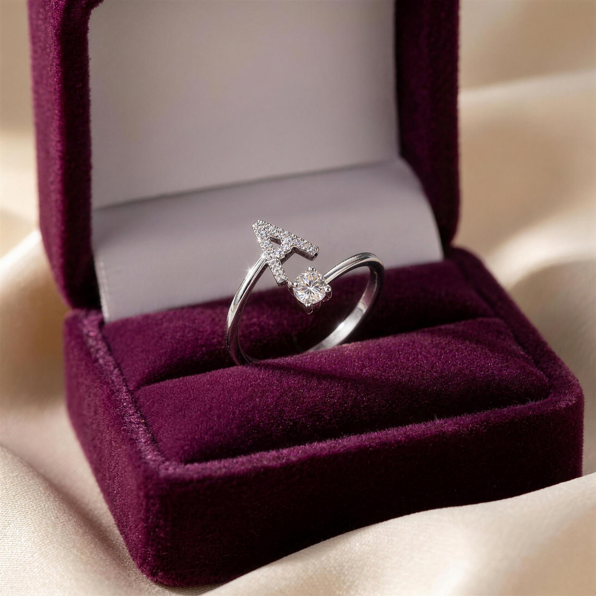 Silver initial ring with letter A in a plum velvet gift box
