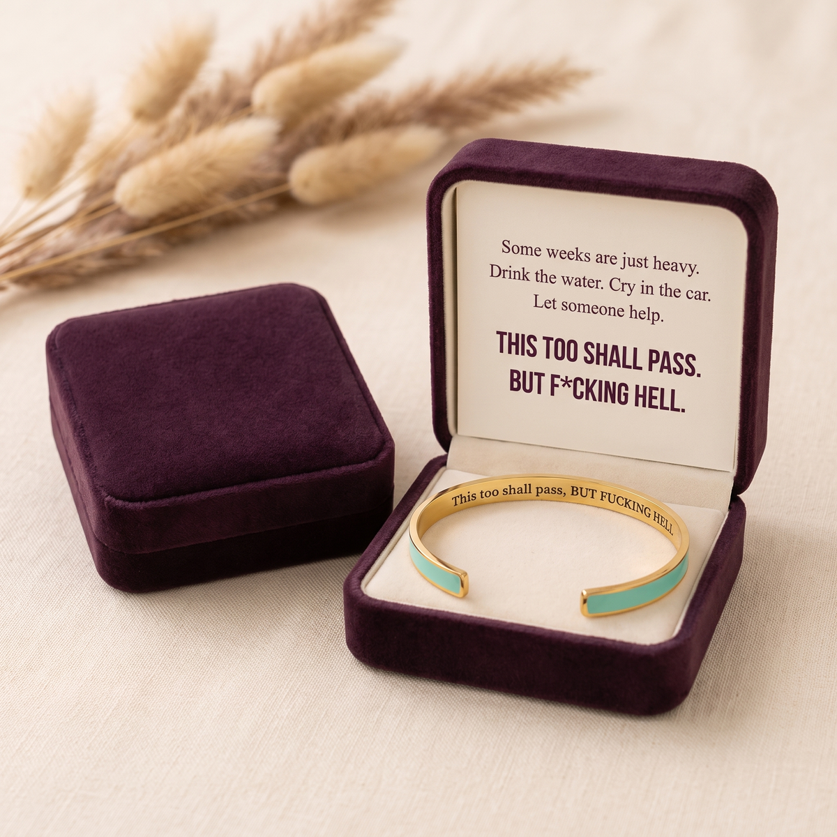 The cuff in the premium plum velvet gift box with its card