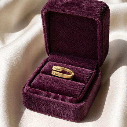The gold ring in a plum velvet gift box