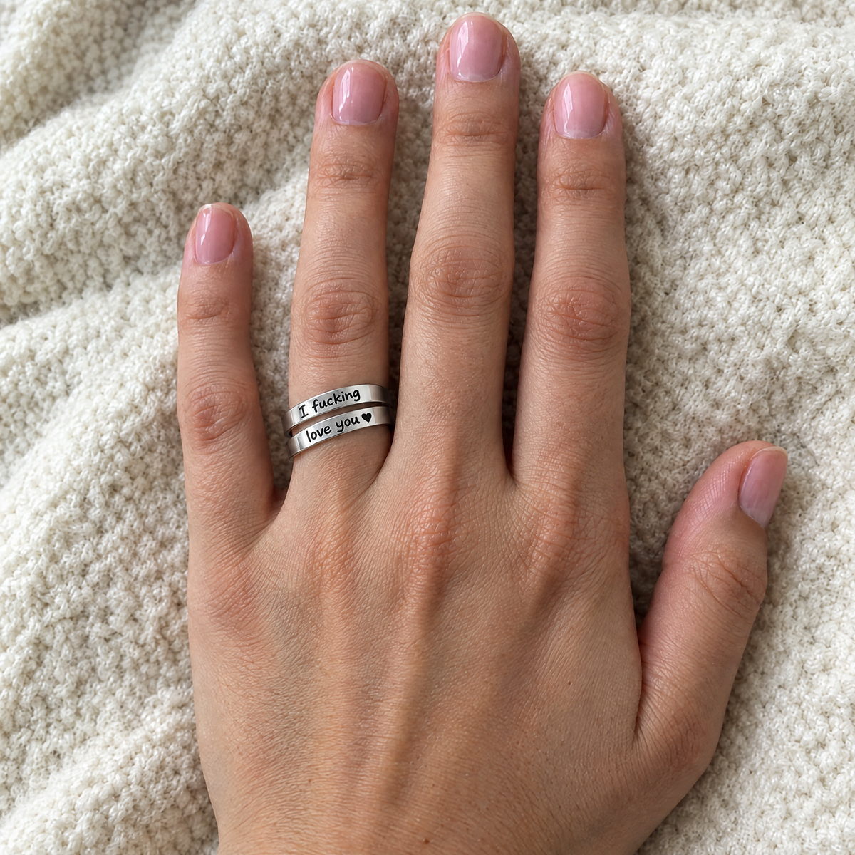 The silver ring worn on the ring finger