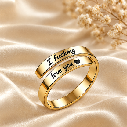 The gold engraved ring on ivory satin