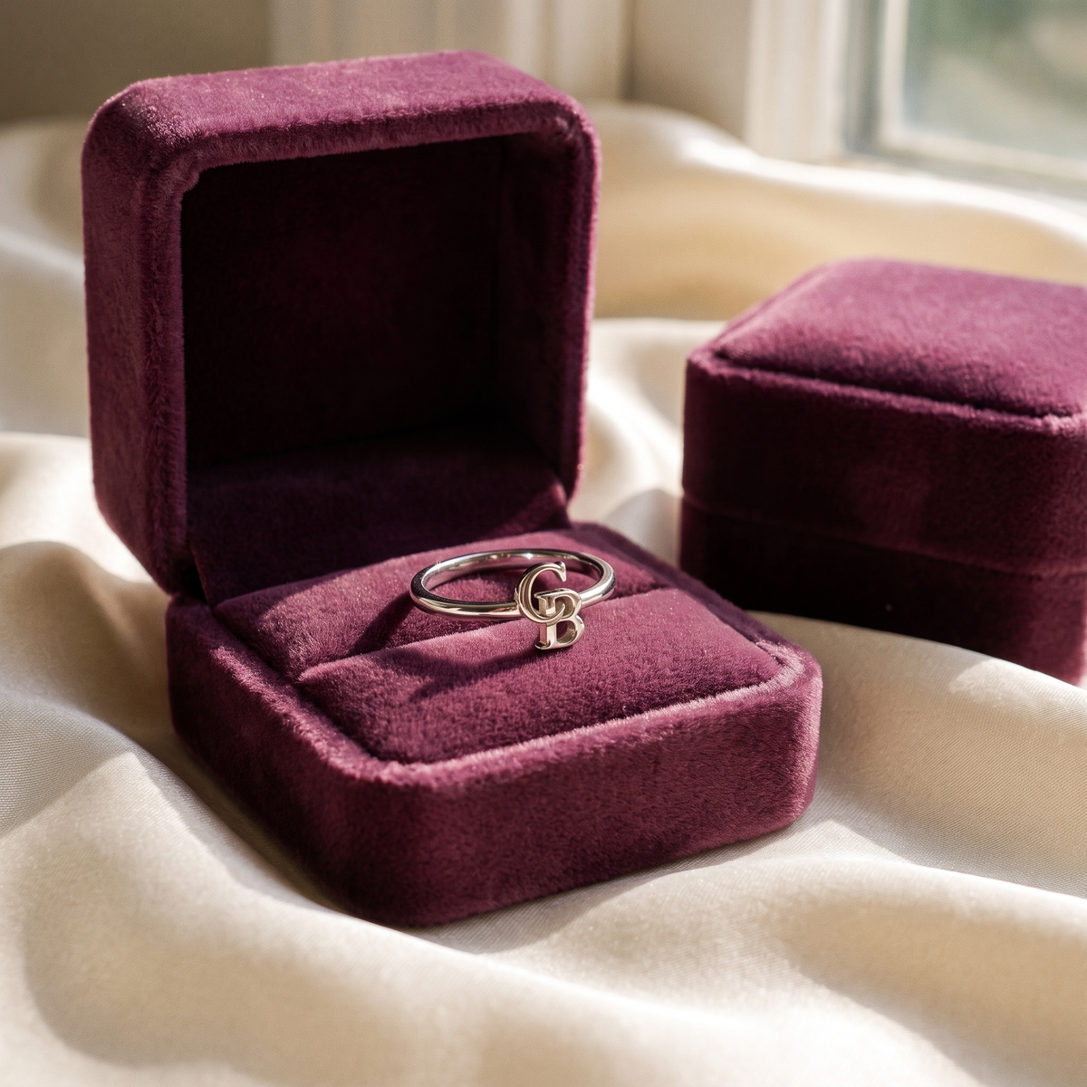 The silver ring in its plum velvet gift box
