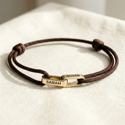 Gold links on brown cord
