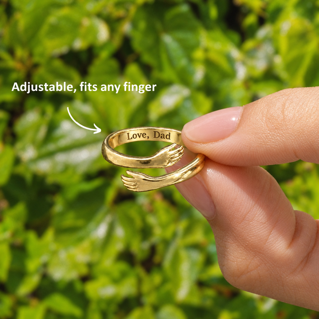 Gold hug ring held between two fingers, Love, Dad engraved inside, adjustable to fit any finger