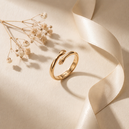 Gold hug ring engraved Love, Dad inside the band, with dried flowers and a satin ribbon