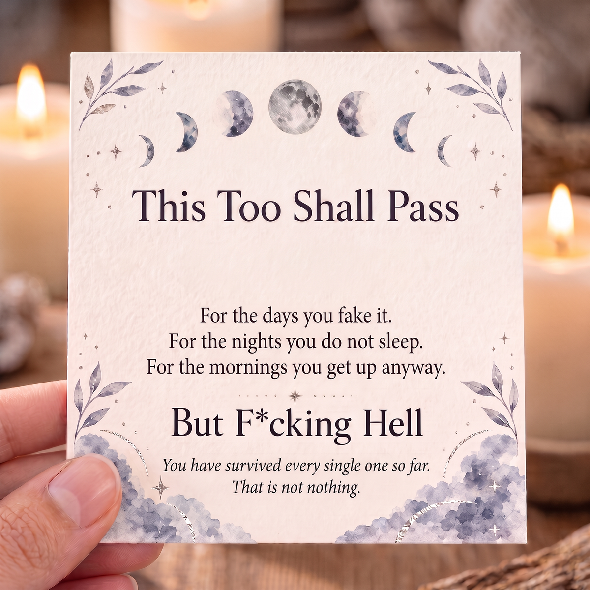 Hand holding the This Too Shall Pass keepsake card