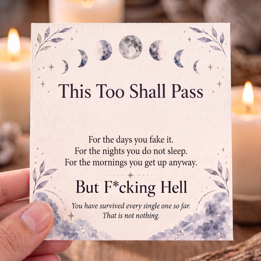 Hand holding the This Too Shall Pass keepsake card