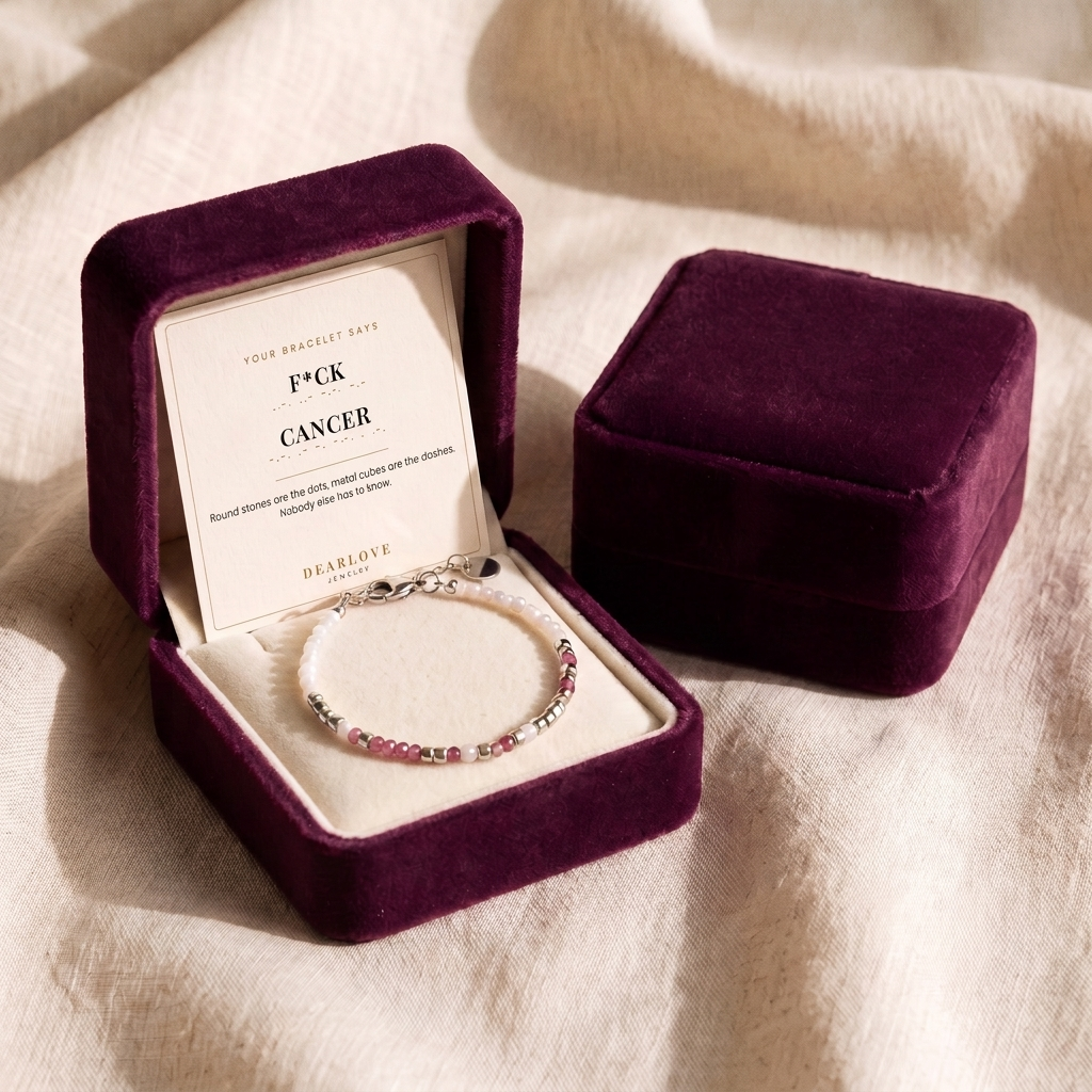 The silver bracelet in its plum velvet gift box with the card in the lid