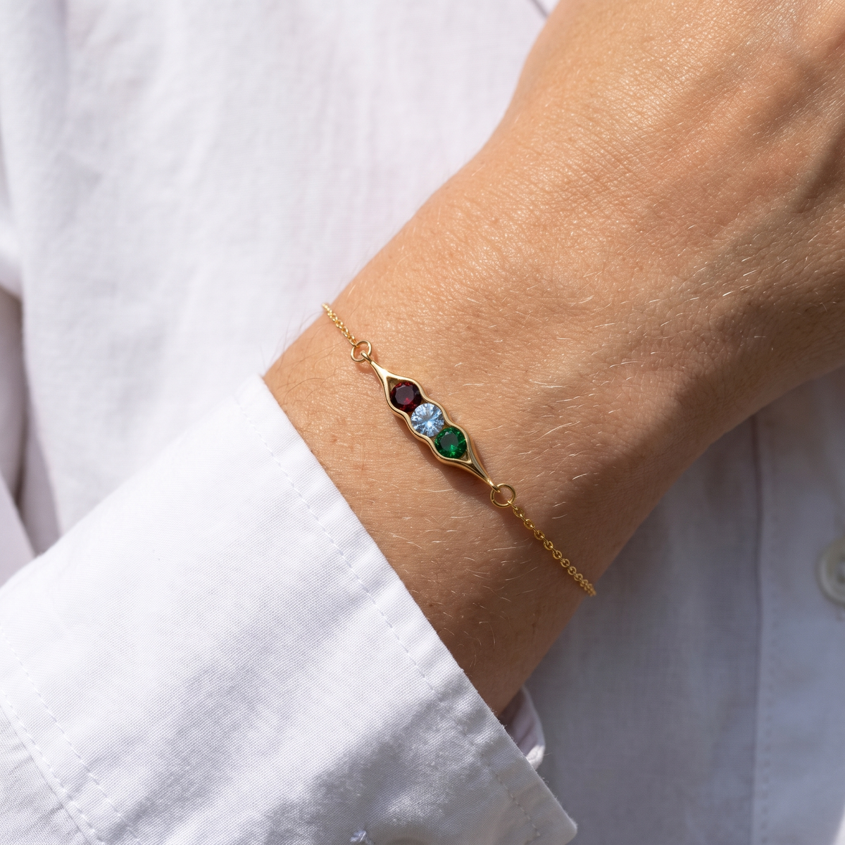 The pea pod bracelet worn on the wrist