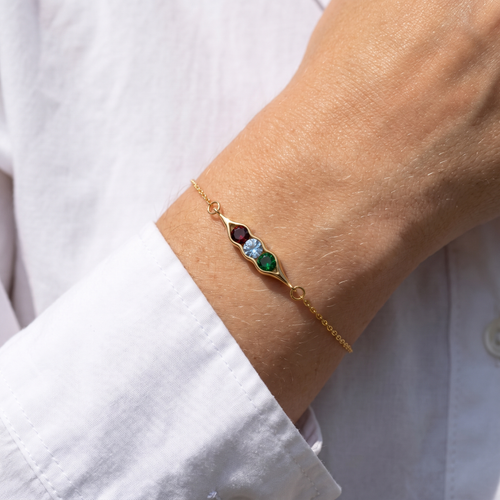 The pea pod bracelet worn on the wrist