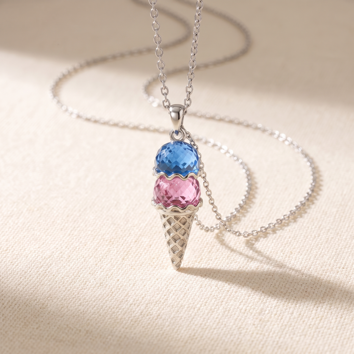 The pendant in silver on cream linen