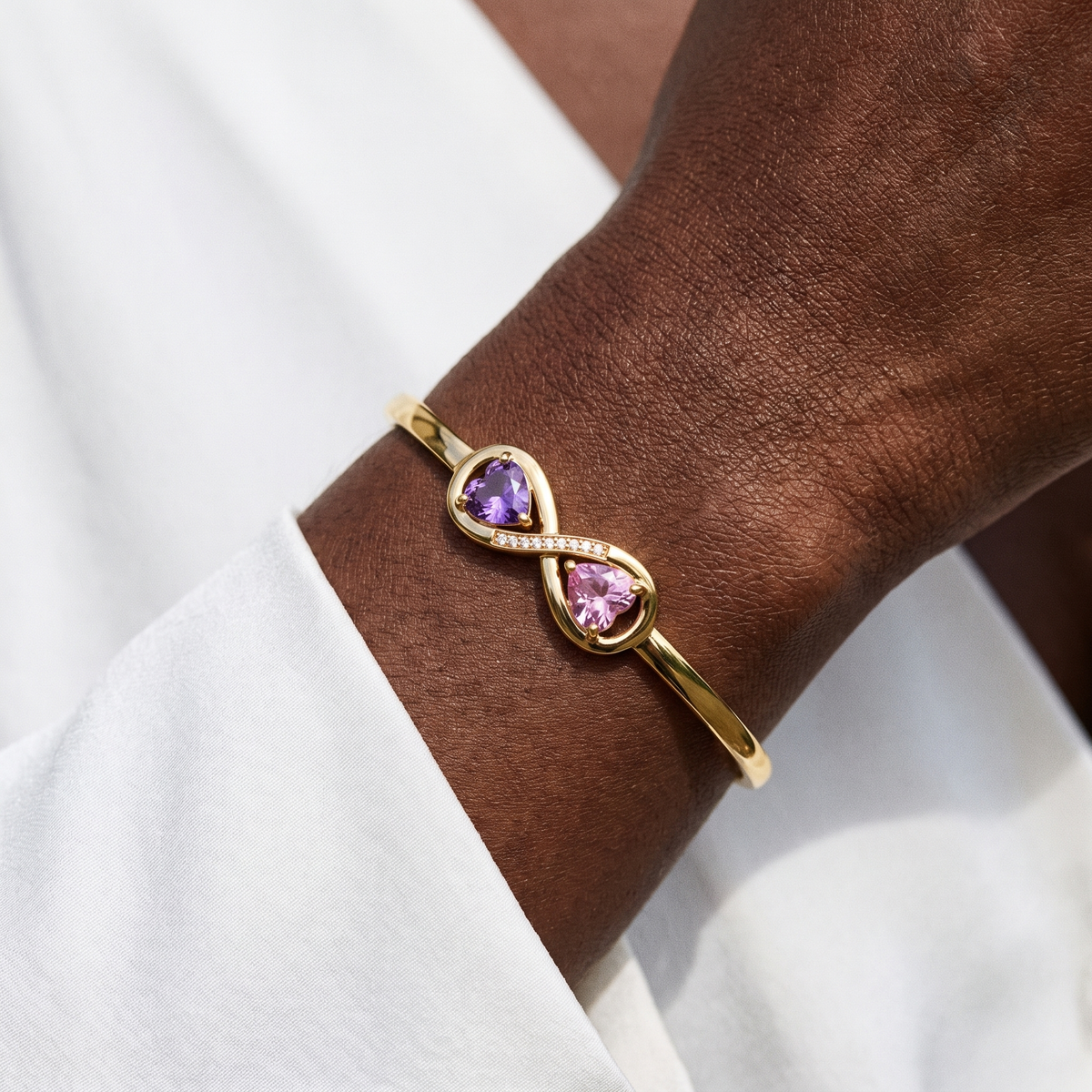 The gold bangle worn on the wrist