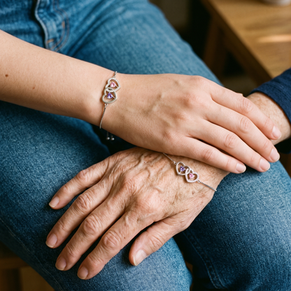 Two generations of hands, both wearing the bracelet
