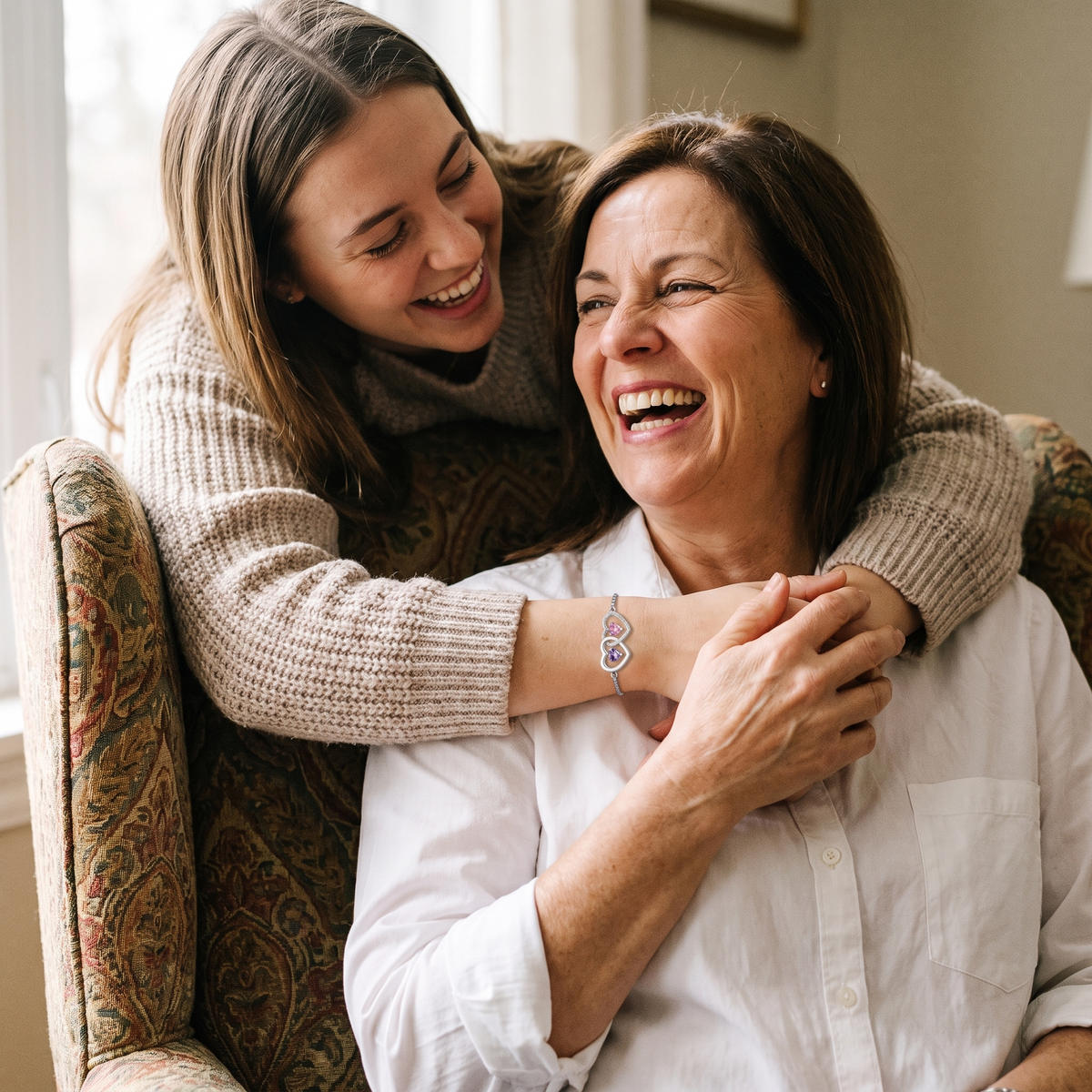 A daughter with her arms around her mother, both laughing