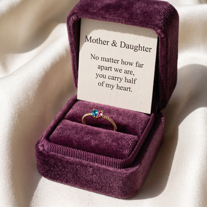 The ring in its gift box with the keepsake card