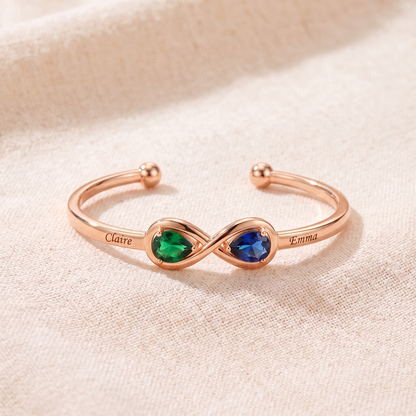 The engraved infinity cuff in rose gold with two heart birthstones